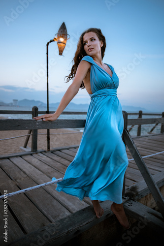 girl on the pier near the sea coast