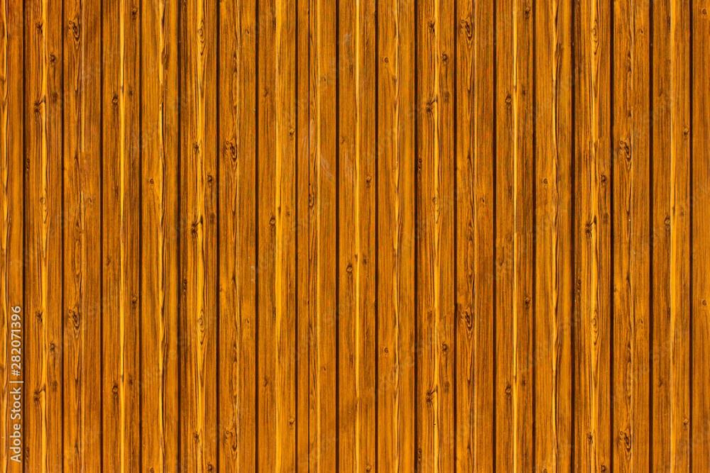 Fence made of wooden vertical bars. Fence made of wooden vertical bars.