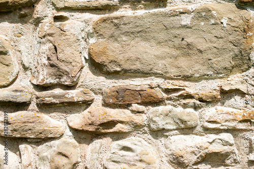 texture of masonry, a fragment of a stone wall of an ancient temple of the 10th century, background, backdrop photo