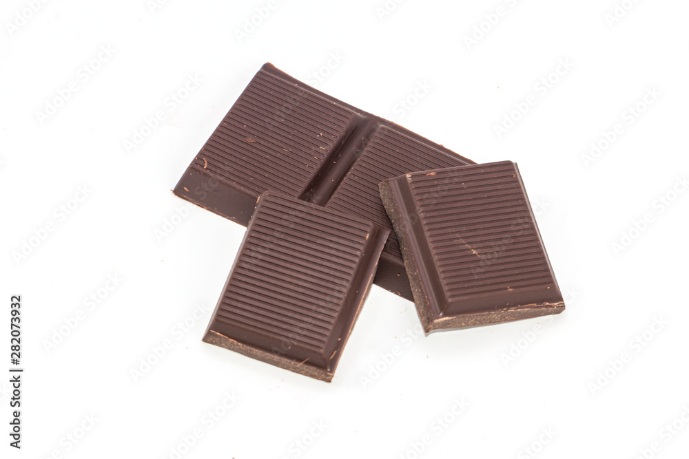 Dark chocolate pieces isolated on white background. Dark chocolate pieces isolated on white background.