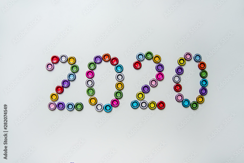 number 2020 of multi-colored, plastic, round buttons number 2020 of multi-colored, plastic, round buttons