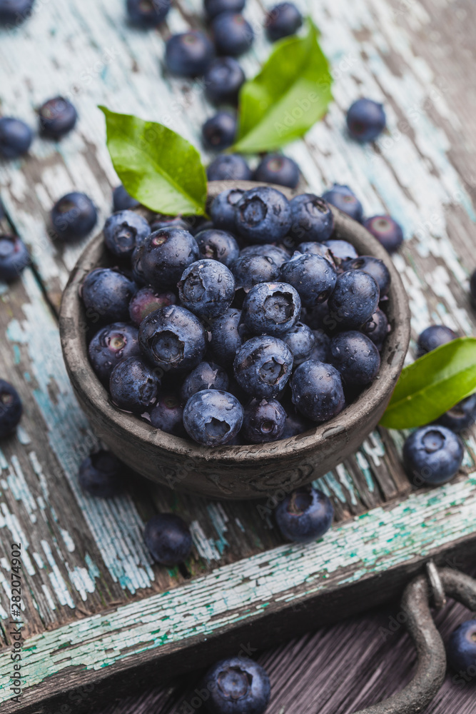 ripe blueberry berries on old wooden table. healthy food ripe blueberry berries on old wooden table. healthy food