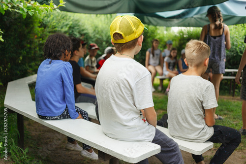 Meeting of children for a game in the camp in a summer sunny day