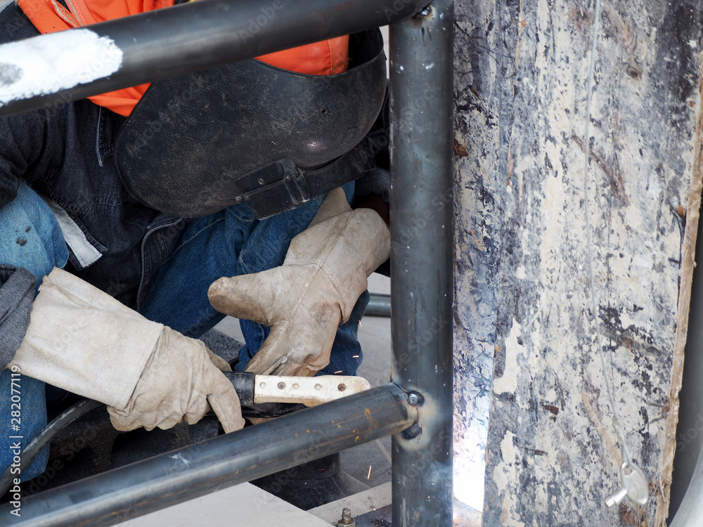 Welding work ,worker with protective welding metal on construction Welding work ,worker with protective welding metal on construction