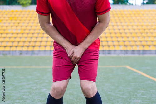 Slika na platnu Cropped close-up photo of human's body closing covering place between legs with