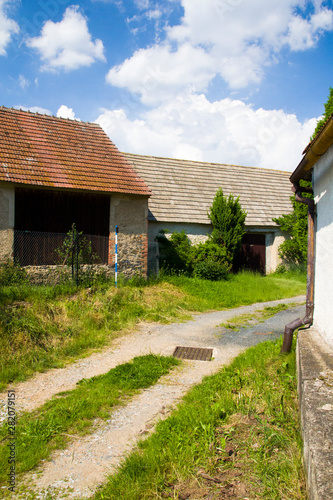 Old rural house in summer sunny day