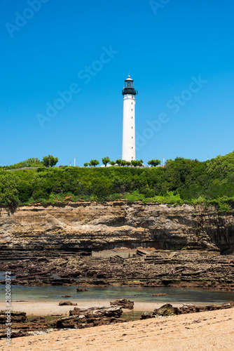 The lighthouse of Biarritz with rocks on the beach. Basque country of France.