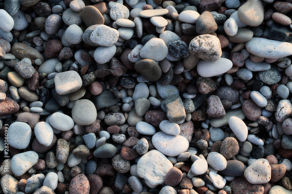 smooth colorful pebbles on the beach smooth colorful pebbles on the beach