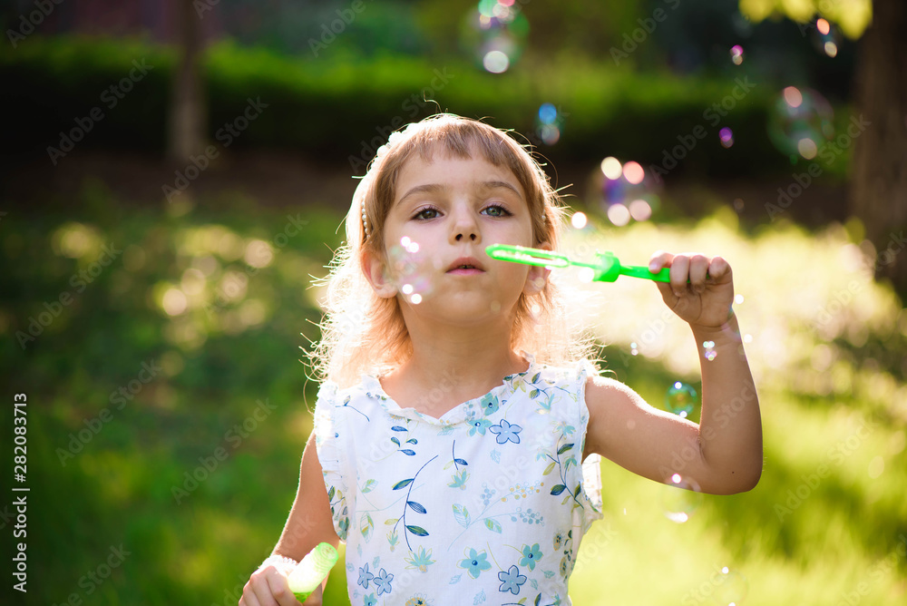 Girl with bubbles at a sunny summer evening Girl with bubbles at a sunny summer evening
