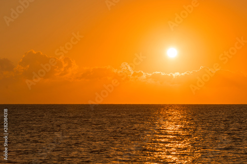Colorful dawn over the sea  Sunset. Beautiful magic sunset over the sea. Beautiful sunset over the ocean. Sunset over water surface