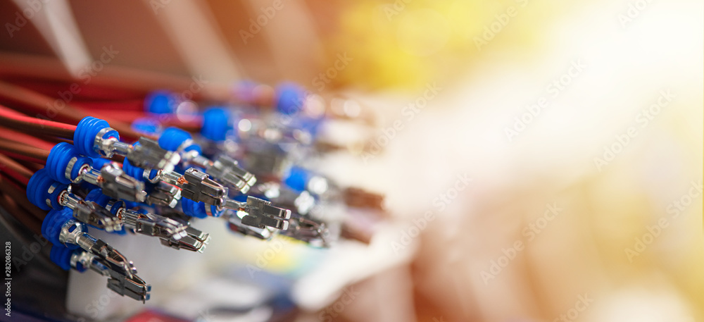 Bundle of crimped cables with electrical connectors. Terminated wire ready to creation connection. Industrial background with copy space for text, soft color effect - obrazy, fototapety, plakaty 