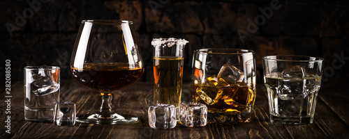 Strong alcohol drinks - whiskey, cognac, vodka, rum, tequila. photo