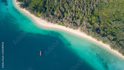 Aerial view of tropical Island white sand beach alonf the pine tree anf turqouise water at Koh Kradan Island, Trang, Thailand. Beach top view. 