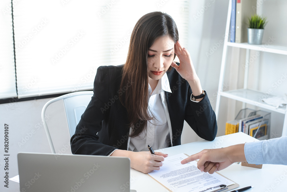 Female employees feel stressed when forced to sign papers with reluctance. Female employees feel stressed when forced to sign papers with reluctance.