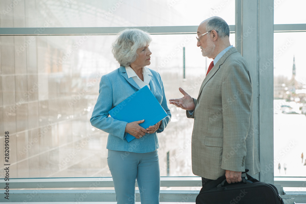 Fototapeta premium Two senior business people talking