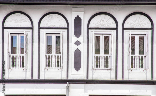 Retro windows on white wall , old town front outdoor view © Mizkit