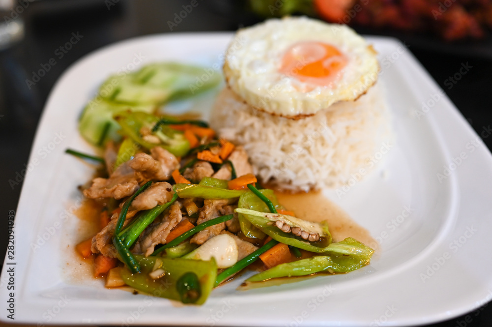 Fried sweet peper pork and fried eggs with rice, Thai food Fried sweet peper pork and fried eggs with rice, Thai food