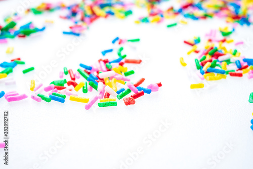 Colorful candy sprinkles close up for birthday cake on white background