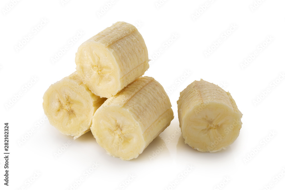 Peeled banana slices isolated over a white background.