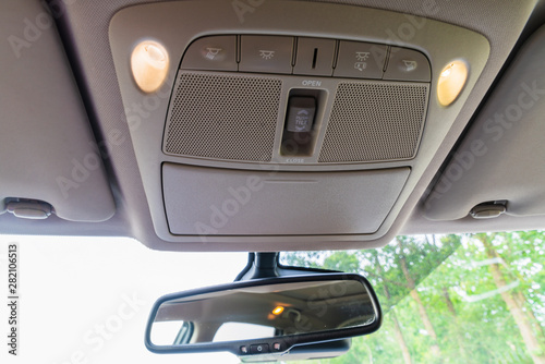 Reading lights and a rearview mirror in a modern car