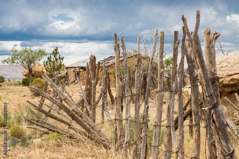 New Mexico Fields with Wooden Fence and Barn Building New Mexico Fields with Wooden Fence and Barn Building