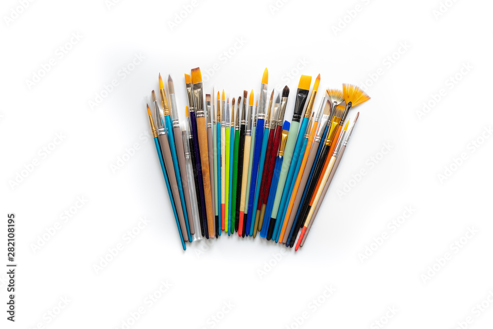 Fototapeta premium Colorful cosmetic brushes close up on white background