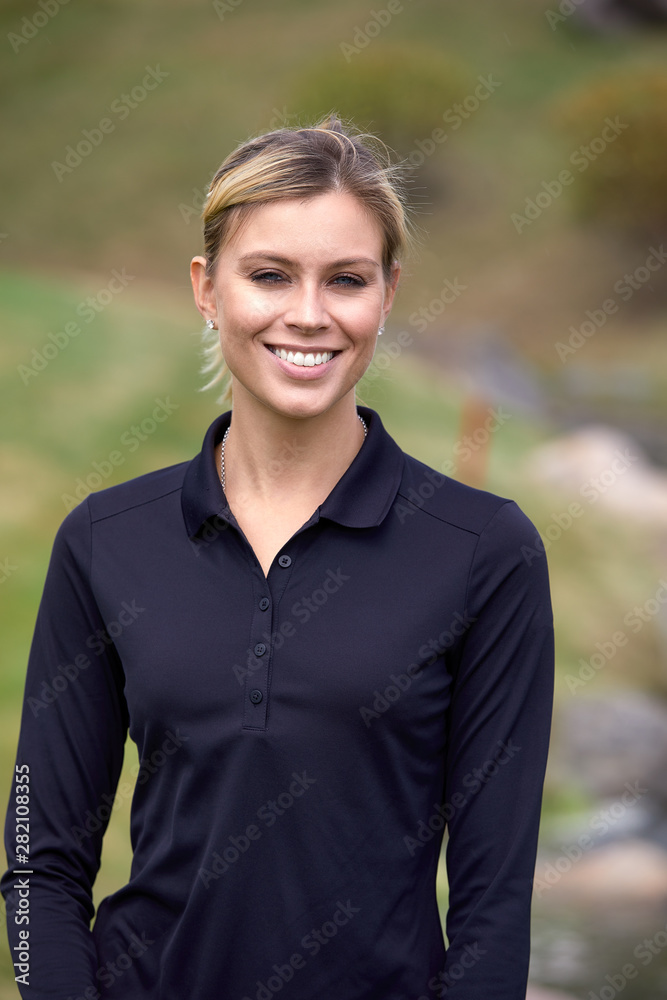 Portrait of a beautiful woman playing golf on a green field outdoors background. The concept of golf, the pursuit of excellence, personal excellence, royal sport. Portrait of a beautiful woman playing golf on a green field outdoors background. The concept of golf, the pursuit of excellence, personal excellence, royal sport.