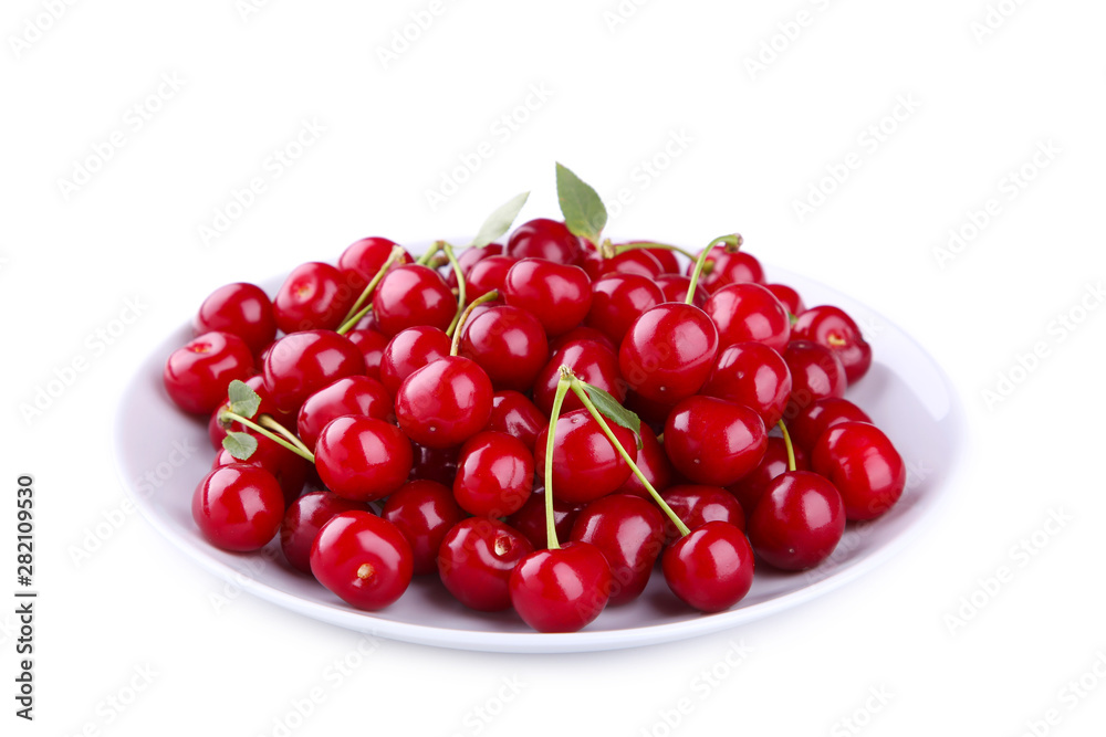Fresh red cherry fruit in plate isolated on white background