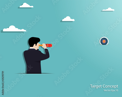 Businessman looking through telescope at to the target