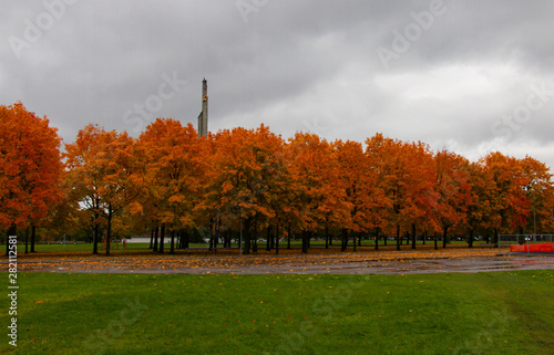 monument to the liberators on the background of the autumn park and thunderclouds photo