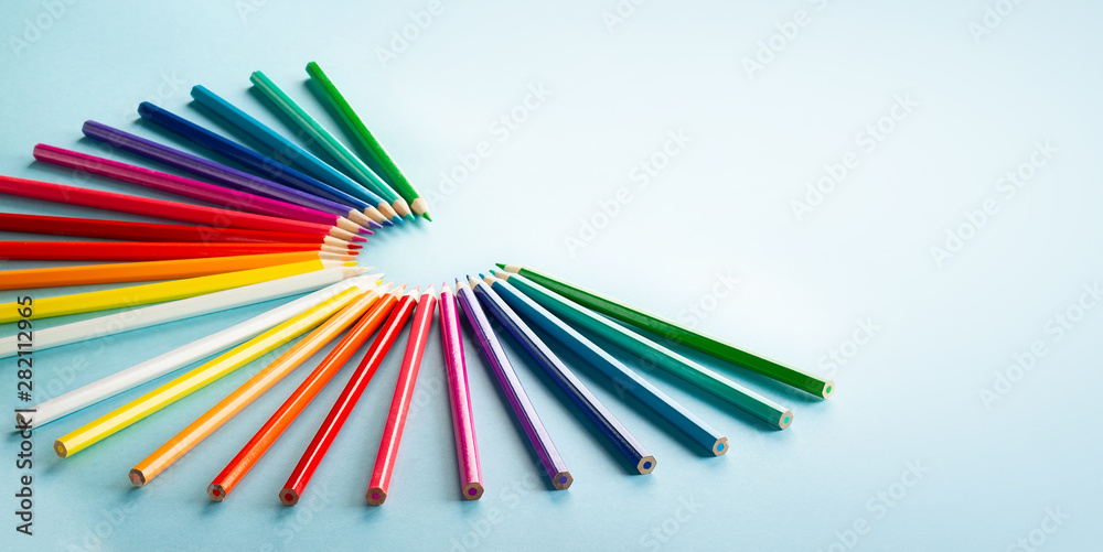 Fototapeta premium Colour pencils set on light blue background