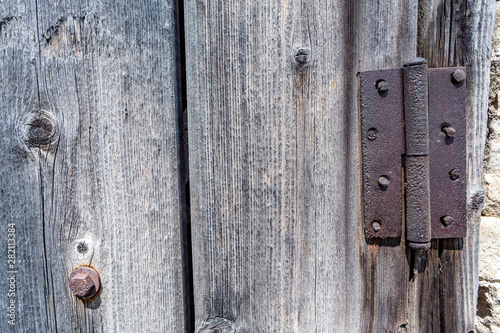 To the righ tdoor loop on an old wooden door,which closes the shed photo