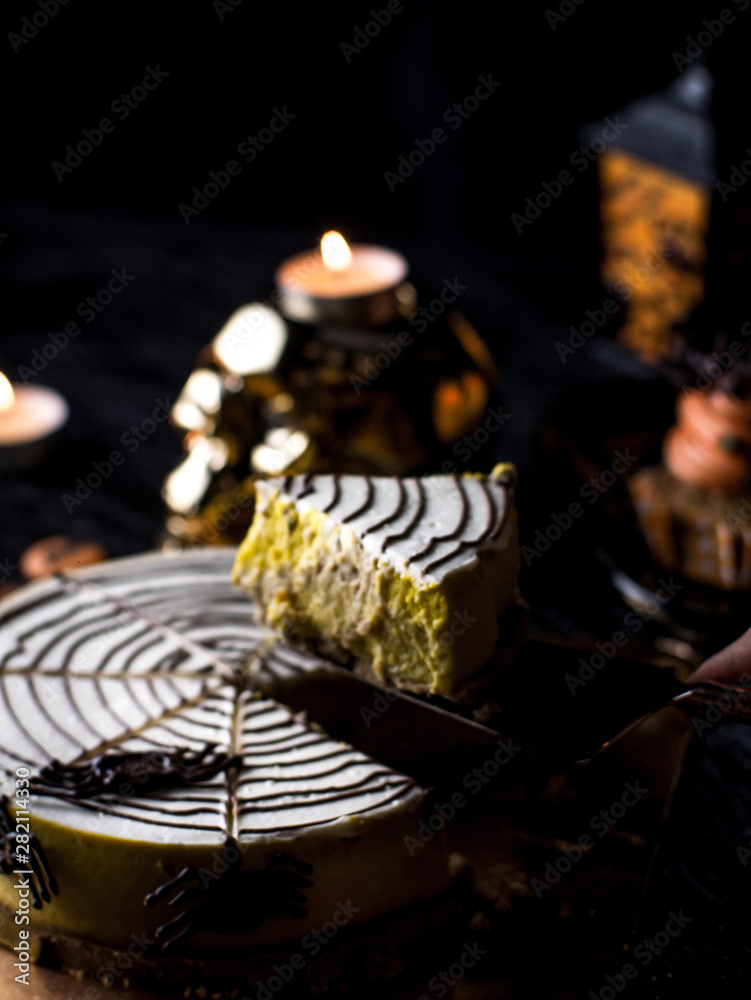 Naklejka premium Fancy Halloween food Party Table with Pumpkin Cupcake Muffin and cookies.