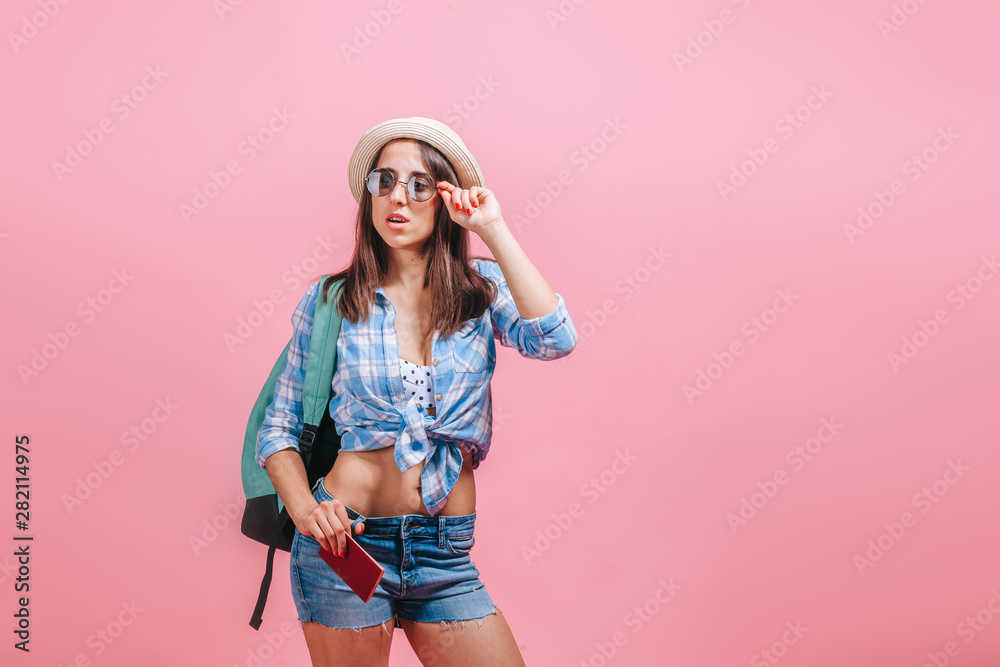 Tourist girl on pink background Tourist girl on pink background