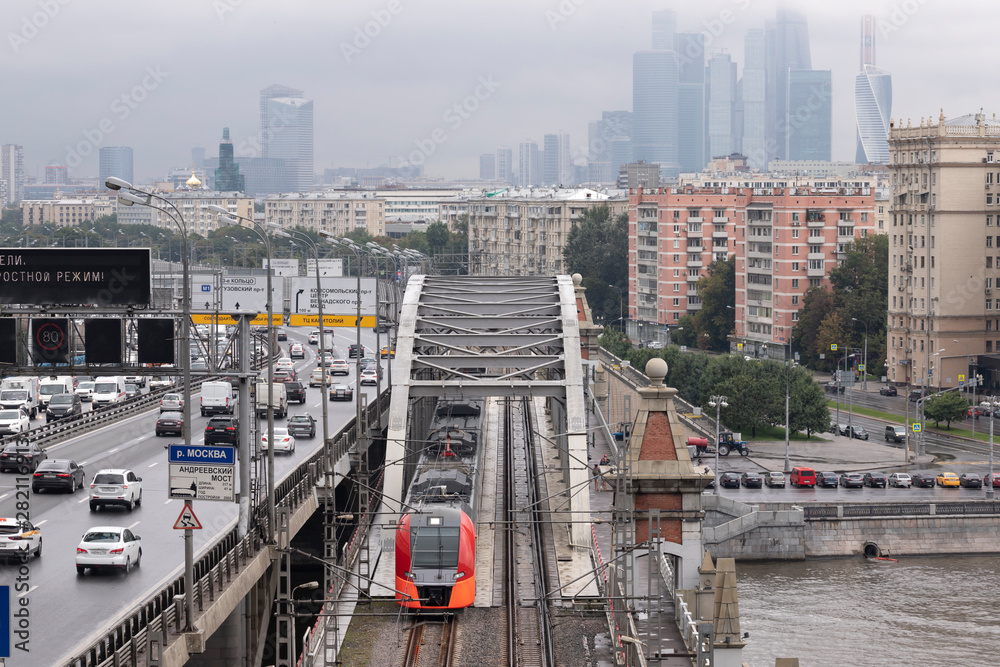Three highways - river, railway and road.  Moscow landscape at cloudy day. Translate: 3rd Ring, Kutuzovsky Avenue,Komsomolsky Avenue,Vernadsky Avenue, MKAD. Drivers, follow the speed limit.