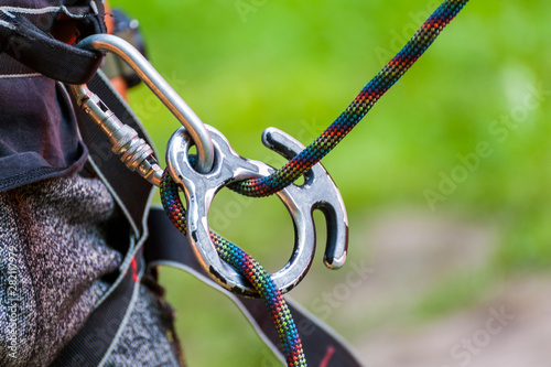 Climbing sports image of a carabiner on a rope