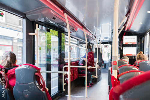 bus interior with people traveling 