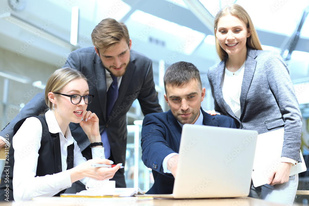 Image of business partners discussing documents and ideas at meeting. Image of business partners discussing documents and ideas at meeting.