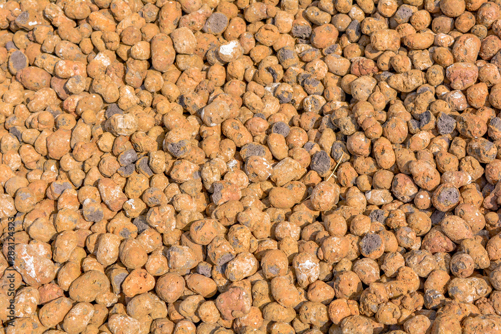 Texture of expanded clay aggregate gravel. Orange clay material for construction Texture of expanded clay aggregate gravel. Orange clay material for construction