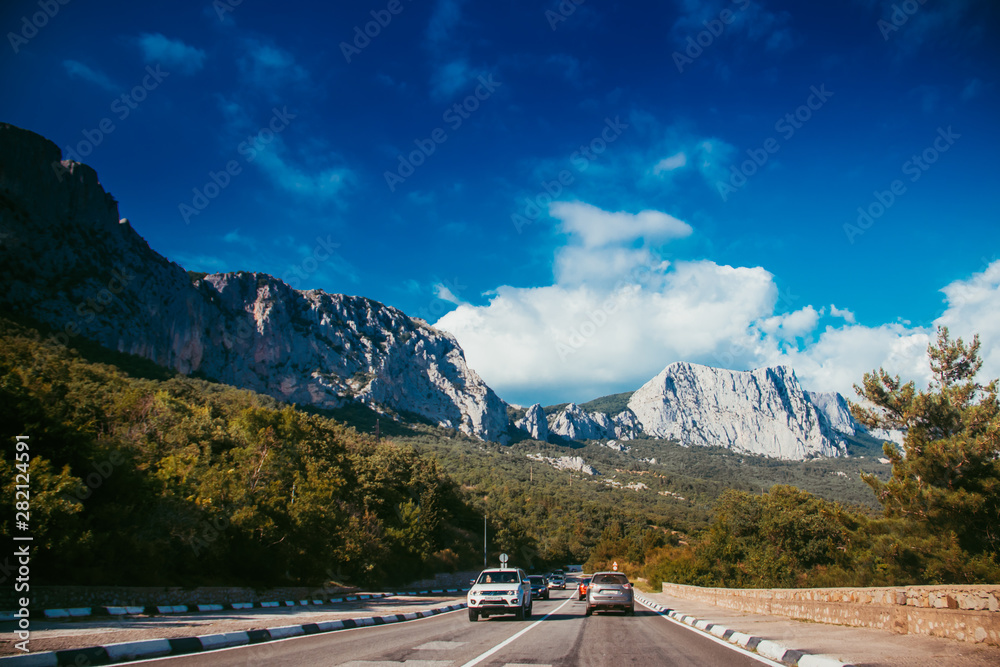 Fototapeta premium Russian asphalt roads. Background road. Roads in the mountains of Crimea. Travel by car. Road views.