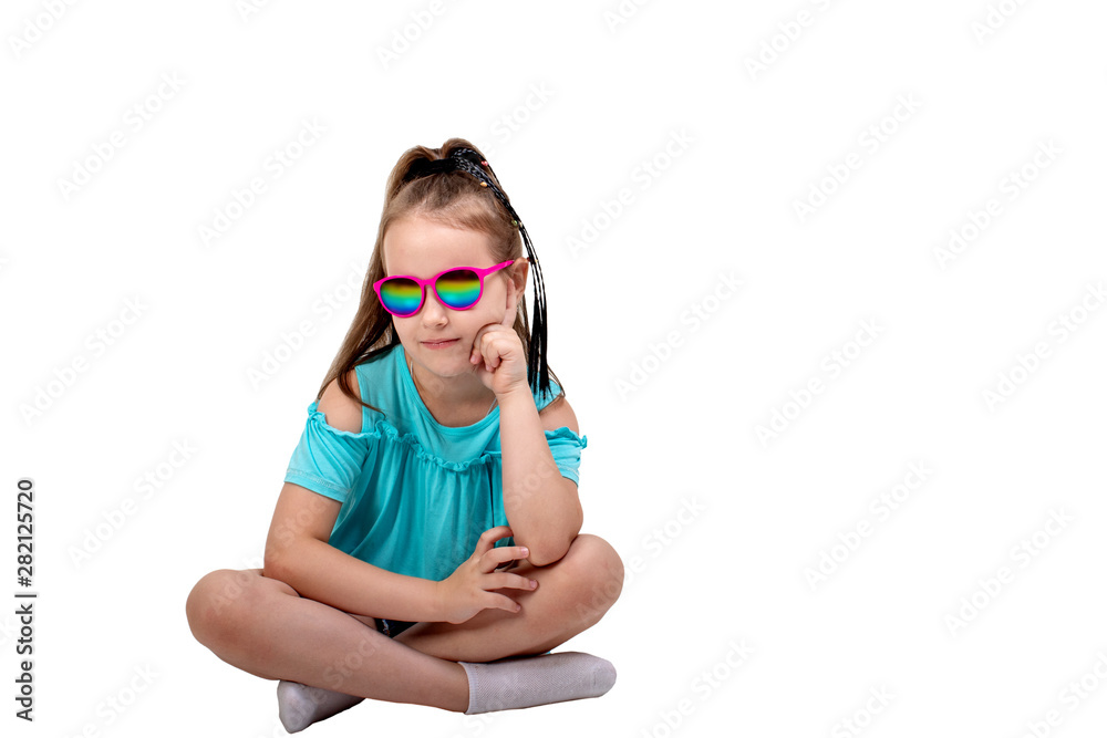 portrait of a fashionable seven-year-old girl in sunglasses on a white background portrait of a fashionable seven-year-old girl in sunglasses on a white background