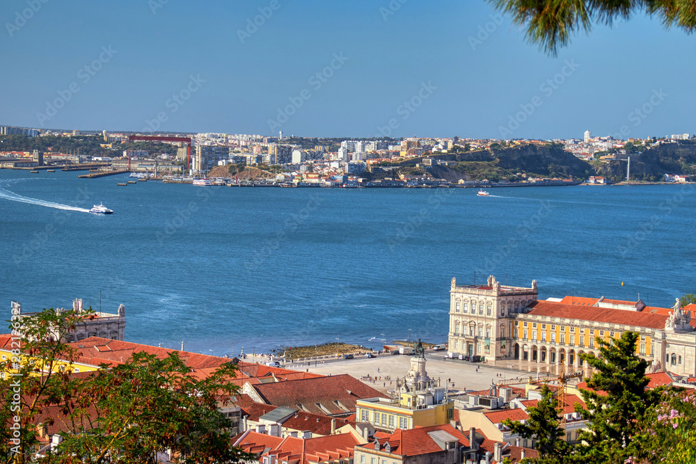 Views of Lisbon where you can see the roofs of their houses and Tagus River.