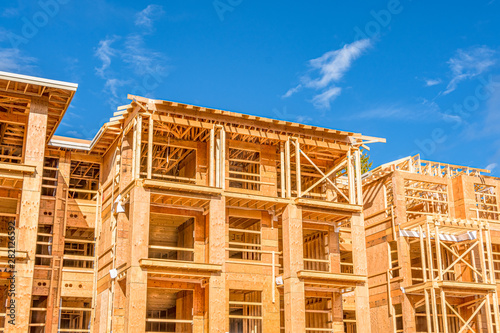 Apartment building under construction on sunny day