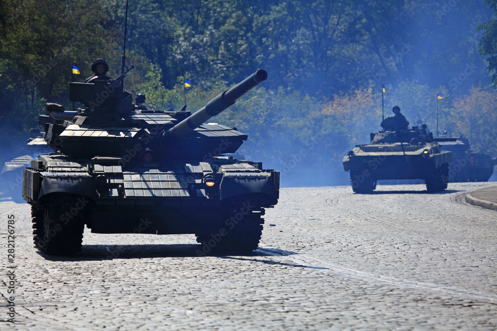 Kyiv, Ukraine - August 24, 2018: Modernized tаnks T-64 BV are driving over the city streets. Military technique parade in Kiev. Independence day celebration. Military equipment of the armed forces Kyiv, Ukraine - August 24, 2018: Modernized tаnks T-64 BV are driving over the city streets. Military technique parade in Kiev. Independence day celebration. Military equipment of the armed forces