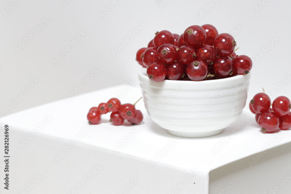 fresh redcurrants in a bowl fresh redcurrants in a bowl