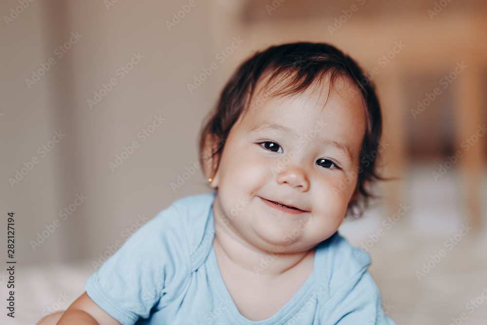 portrait of cute mixed raced girl lie on bed portrait of cute mixed raced girl lie on bed