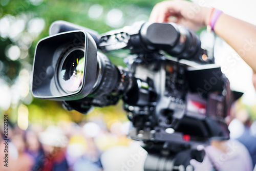 Professional cameraman working with digital video camera for live streaming event