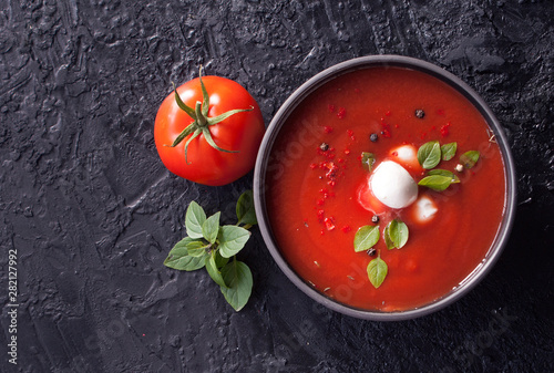 Tableau sur toile Summer cold tomato vegetable soup Gazpacho on the black table