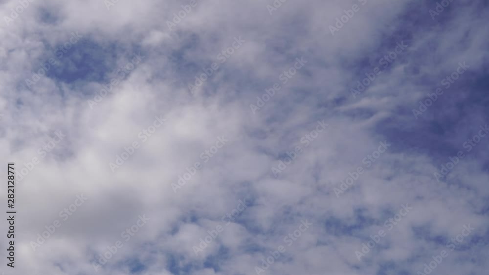 White clouds against a blue sky. The texture of the clouds. White clouds against a blue sky. The texture of the clouds.