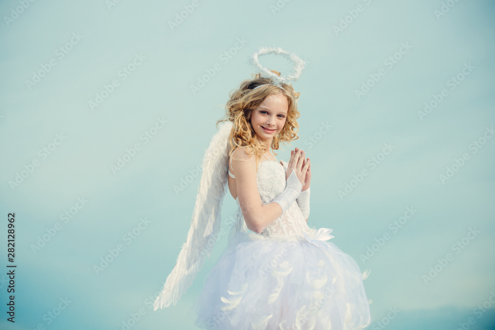 Valentine. Cherub angel pray. Pretty white little girl as the cupid congratulating on St Valentines day. Real fairy from magical stories. Angel children girl with white wings pray. Valentine. Cherub angel pray. Pretty white little girl as the cupid congratulating on St Valentines day. Real fairy from magical stories. Angel children girl with white wings pray.